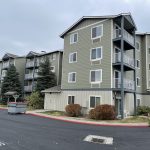 Green painted apartment building